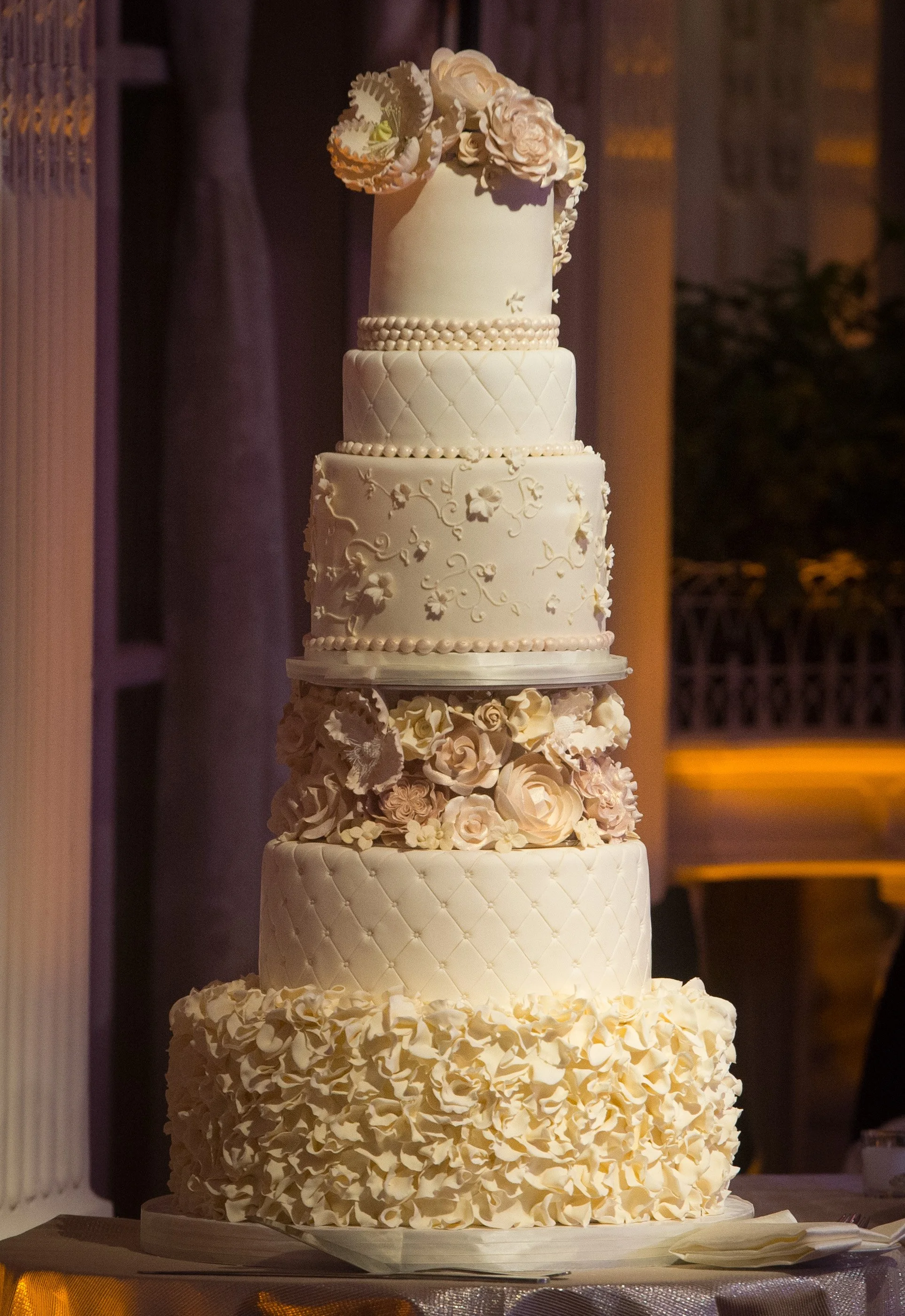 Opulent towering champagne wedding cake in Newport, Rhode Island